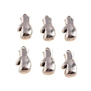 Detail of silver alloy boxing glove charms with top loop for DIY jewelry making