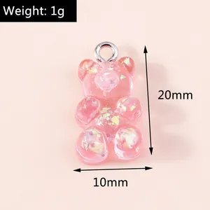 Pink resin gummy bear charm with glitter showing dimensions 20mm by 10mm and 1g weight