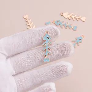 Cute sky blue fish bone alloy pendant with gold edges for DIY necklace jewelry making