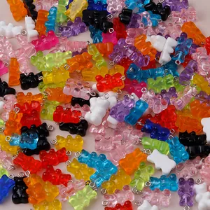 Detailed view of colorful resin gummy bear charms with metal eyelet pins for DIY jewelry