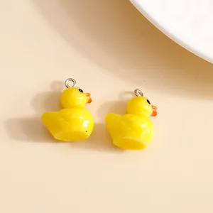 Set of two yellow acrylic duck charms with silver metal rings for DIY jewelry making