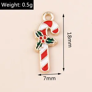 Macro shot of candy cane pendant with holly leaf detail and 18mm height measurement