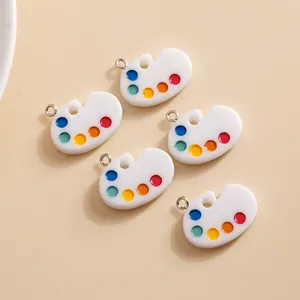 Macro shot of artist palette charms in colorful acrylic resin for DIY jewelry making