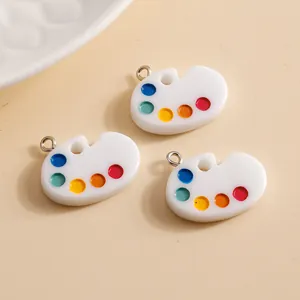 Set of three colorful palette resin pendants with silver metal rings for DIY jewelry