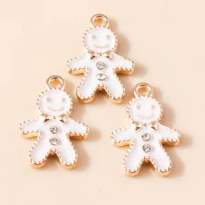 Three cute gingerbread man pendants with white enamel and rhinestones for DIY jewelry