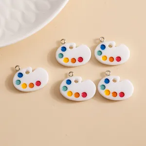 Five colorful acrylic palette-shaped pendants for DIY jewelry making with metal rings