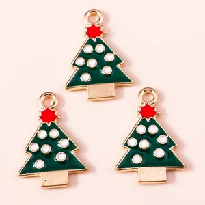 Set of three green enamel Christmas tree alloy pendants with red star and gold plating