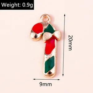 Detail of 20mm Christmas candy cane pendant with red green enamel and gold bow knot