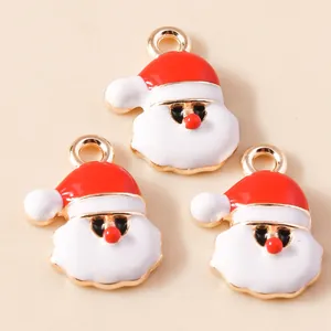 Macro shot of three Santa Claus alloy enamel charms for DIY necklace jewelry making