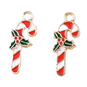 Set of 10 festive enamel Christmas candy cane charms with holly leaves and gold finish