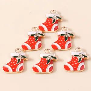 Set of 6 red enamel Christmas stocking charms with gold alloy base and crystal accents