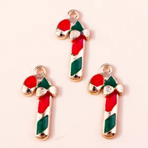 Three Christmas candy cane alloy pendants with red and green enamel and gold finish