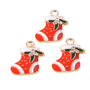 Set of three red Christmas stocking pendants in alloy with enamel and rhinestones