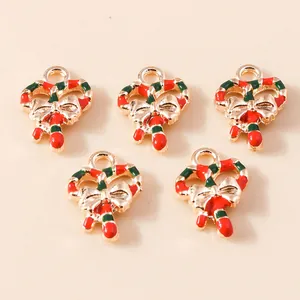 Five gold-toned enamel Christmas candy cane heart charms with a festive red and green bow