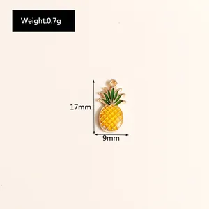 Detail showing dimensions of yellow pineapple pendant measuring 17mm by 9mm