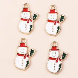 Set of four cute enamel snowman pendants with red hats and golden edges for DIY jewelry