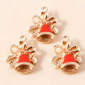 Three red enamel Christmas bell pendants with gold bows for DIY jewelry making and crafts