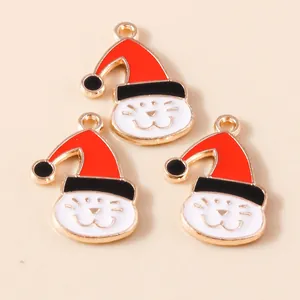 Detailed close-up of cute Christmas cat pendants with red hats and golden edges for DIY
