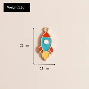 Detail of colorful enamel rocket pendant with dimensions 25mm x 11mm and weight 1.3g
