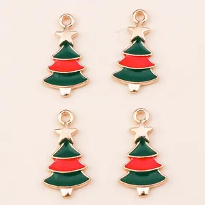Set of four Christmas tree charms with green and red enamel in gold-tone alloy