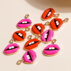 Macro detail of red and pink lip charms with polished gold metal edges for DIY jewelry