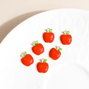 Set of six red apple alloy charms with green leaves and gold finish for DIY jewelry