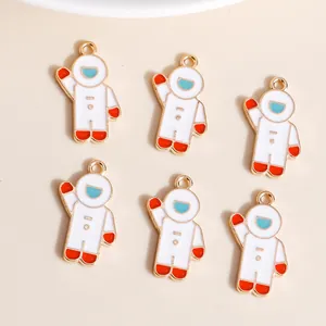 Set of six cartoon astronaut charms in gold alloy with white and blue enamel