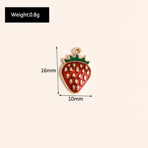 Detail showing red enamel strawberry pendant dimensions of 16mm height and 10mm width