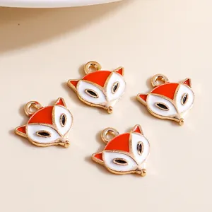 Golden alloy fox head pendants with red and white enamel for DIY jewelry making
