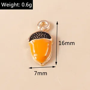 Macro view of tiny acorn enamel charm with weight 0.6g and size dimensions 16mm x 7mm