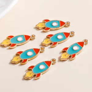 Set of 6 cartoon rocket alloy charms with blue and red enamel for DIY jewelry making