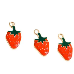 Three red strawberry alloy charms with gold seeds and green leaves for DIY jewelry making