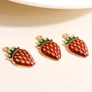 Three handmade enamel strawberry pendants in red and green with gold plating
