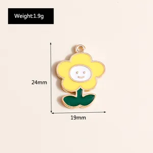 Detail of yellow smiley sunflower pendant with green leaves, 24mm x 19mm DIY charm