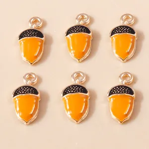 Set of six acorn alloy pendants with orange enamel finish and gold metal loops for DIY jewelry