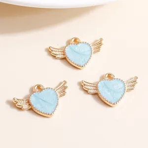 Three light blue enamel heart pendants with golden wings for DIY necklace making