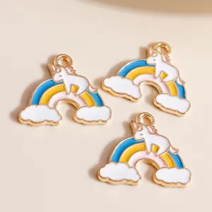 Detailed view of colorful unicorn and rainbow charms for DIY jewelry making