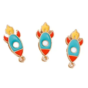 Three-piece set of cartoon space rocket enamel pendants with golden metal trim for DIY crafts