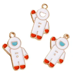 Three cute cartoon astronaut enamel pendants in gold-plated zinc alloy for DIY jewelry