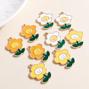 Macro detail of colorful smiley flower charms with golden edges for jewelry making