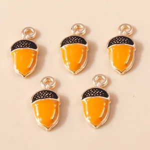Five orange enamel acorn charms with gold plating and black tops for DIY jewelry making