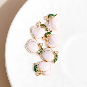 Pink enamel peach fruit pendants with gold edges and green leaves for DIY jewelry