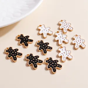 Detail of 10 pack black and white alloy bear pendants with gold star patterns for DIY jewelry