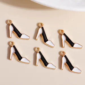 Minimalist high heel charm pendants in black and white enamel with gold metal frame