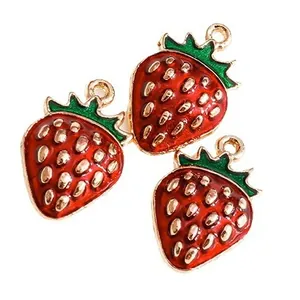 DIY strawberry enamel charms made of red and green alloy with golden accents for necklaces