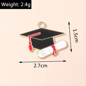 Detail view of graduation cap and diploma enamel pendant with size and weight specs