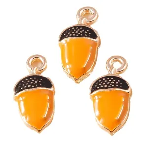 Three acorn-shaped alloy pendants with orange and black enamel for DIY jewelry making