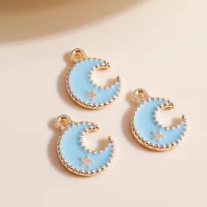 Light blue enamel moon charms with gold stars and beaded edges for DIY jewelry
