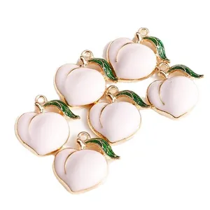 Set of 6 pink peach fruit charms in enamel alloy with gold edges and green leaves