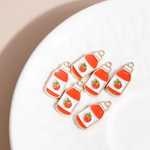 Set of 6 strawberry milk bottle charms made of gold metal and colorful enamel